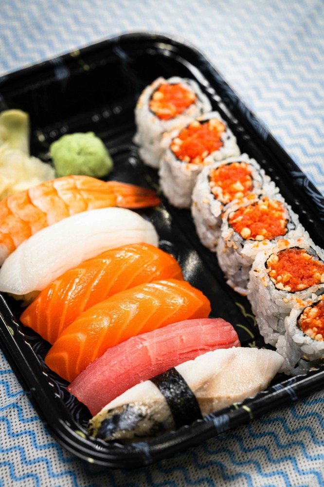 Sushi and sashimi combo with salmon nigiri, tuna, yellowtail and tobiko maki at AB Fish Market